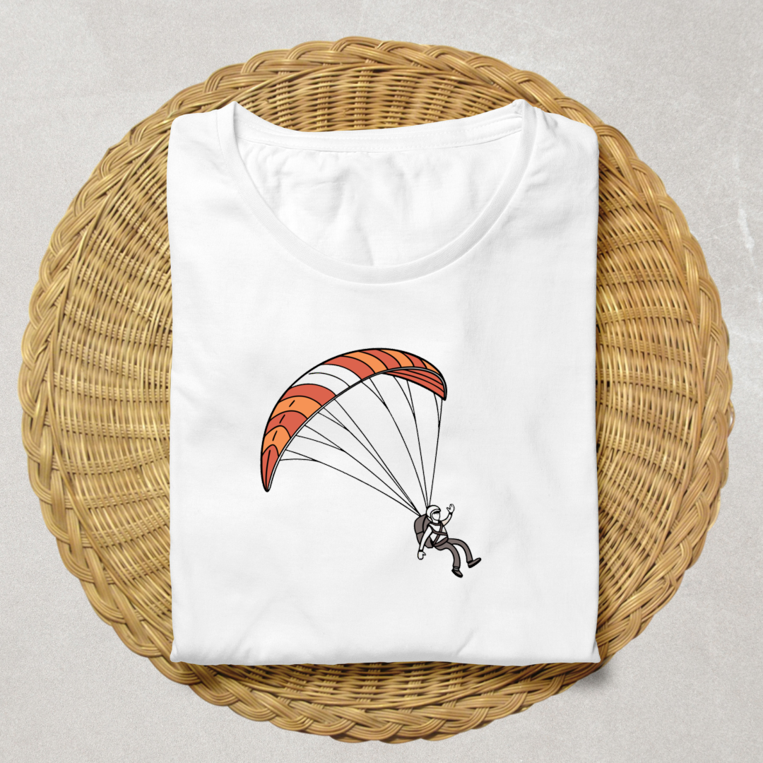 T-shirt graphique avec motif parapentiste en vol dans un style aérien dynamique