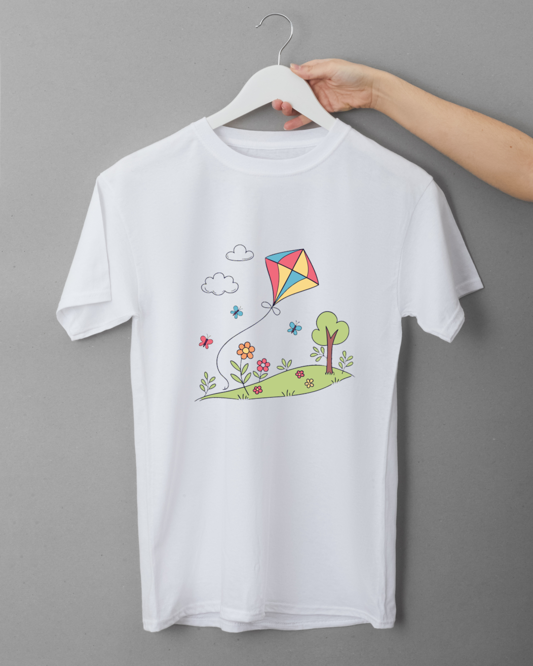 T-shirt illustré d'un cerf-volant coloré dans un style doodle ludique et printanier