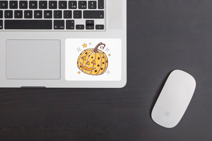 Sticker festif affichant une citrouille étoilée joyeuse pour Halloween