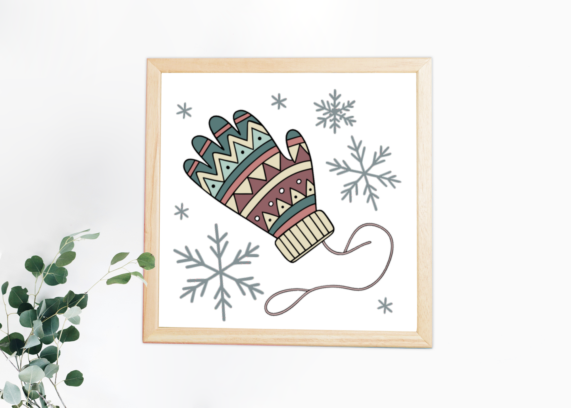 Cadre mural en bois avec visuel hivernal de gants et flocons de neige