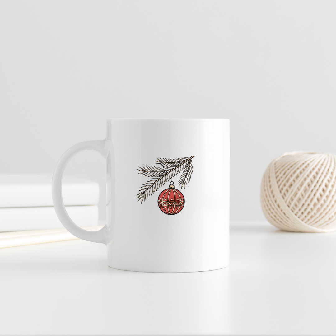 Mug avec motif festif orné d'une élégante boule de Noël suspendue