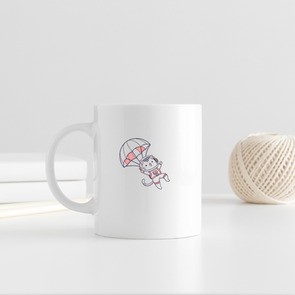 Mug esquissant un chat espiègle en parachute dans un style aérien coloré