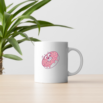 Mug blanc décoré d'un donut pastel joyeux, parfait pour savourer des moments sucrés