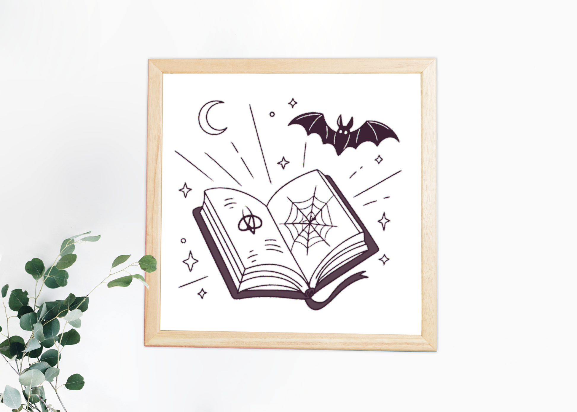 Cadre au style mystique avec livre et chauve-souris pour une touche halloween