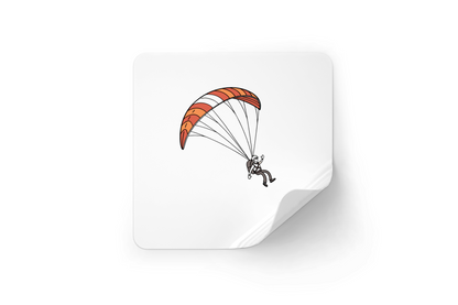 Sticker vibrant avec un parapentiste en plein vol, parfait pour les fans d'aventure