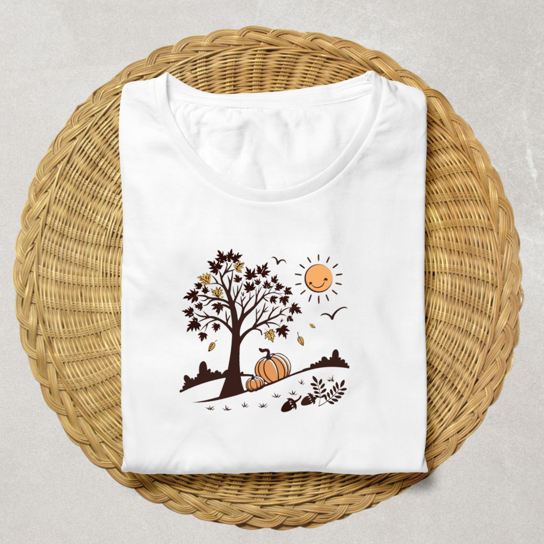 T-shirt automnal avec arbre stylisé et citrouilles souriantes