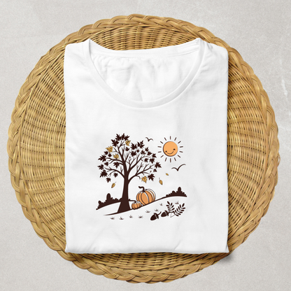 T-shirt automnal avec arbre stylisé et citrouilles souriantes