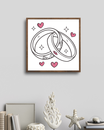 Cadre mettant en valeur des alliances sur fond romantique.
