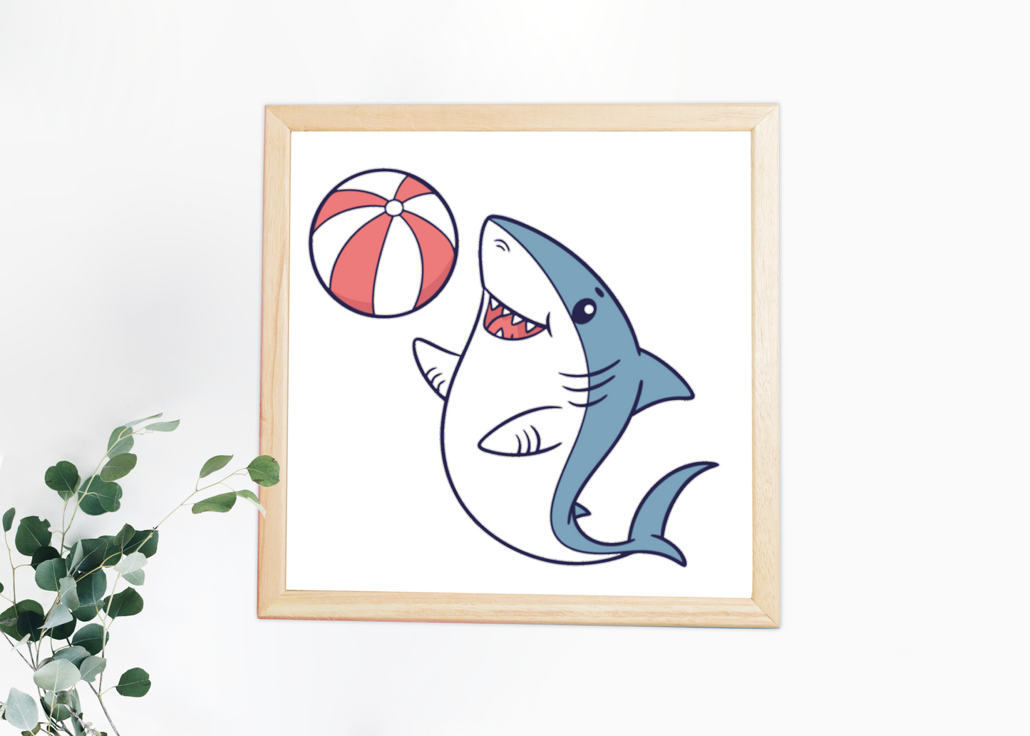 Cadre décoratif présentant un requin enjoué jouant avec un ballon dans une ambiance marine