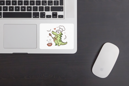 Sticker représentant un crocodile joyeux en chef cuisinier, design ludique et coloré
