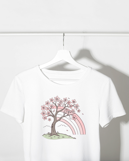 T-shirt design pastel avec cerisier en fleurs et arc-en-ciel pour un printemps joyeux