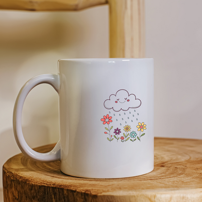 Mug en céramique avec un nuage souriant pastel arrosant des fleurs délicates