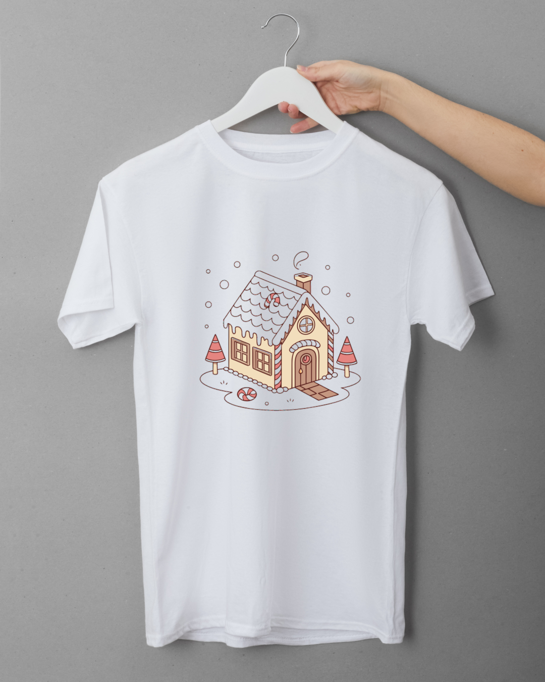 T-shirt décoré d'une maison de Noël enneigée dans un style doodle pour fête hivernale