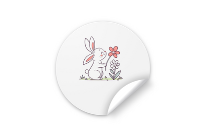 Sticker orné d'un lapin souriant tenant une fleur, motif doux et printanier