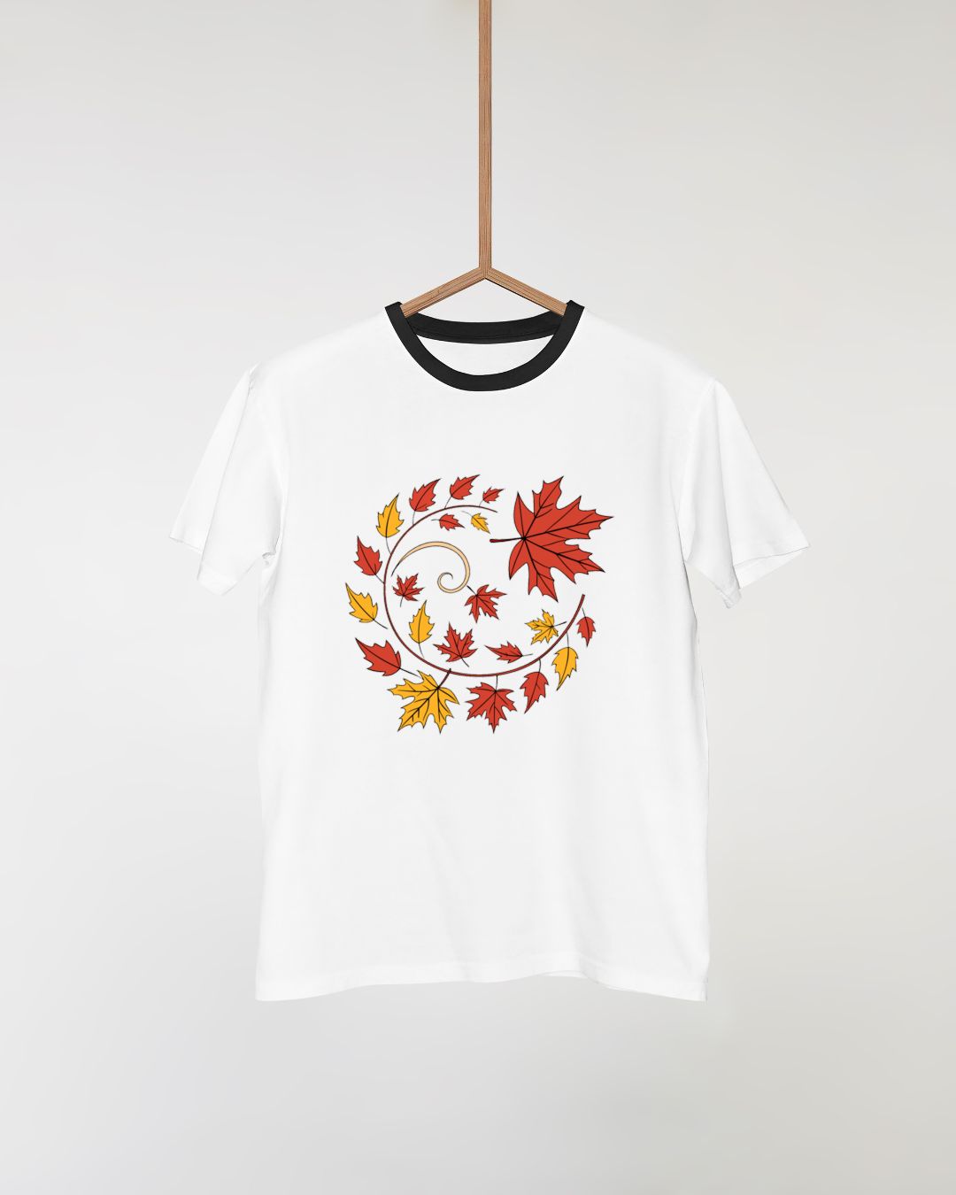 T-shirt automnal avec feuilles colorées tourbillonnantes au style graphique vivant