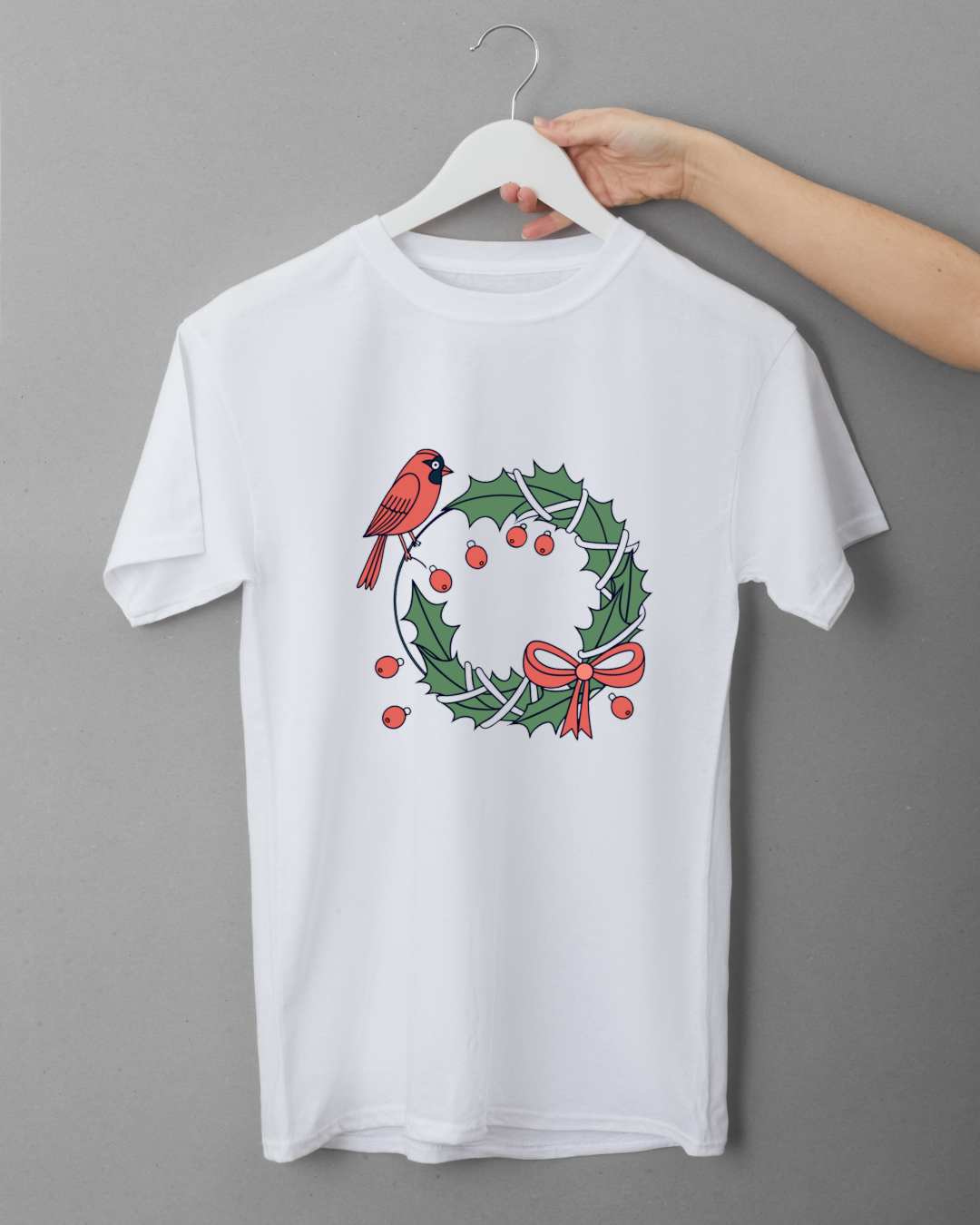 T-shirt festif avec cardinal joyeux posé sur une couronne illustrée style Noël