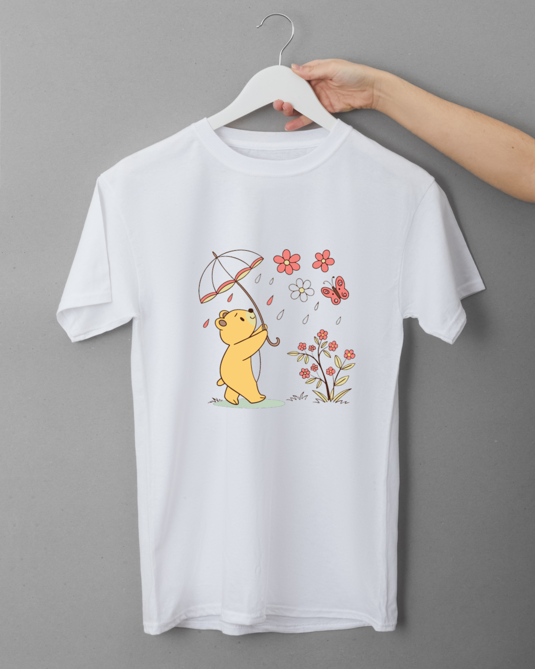 T-shirt avec ours joyeux sous parapluie, style doux, ambiance printanière colorée
