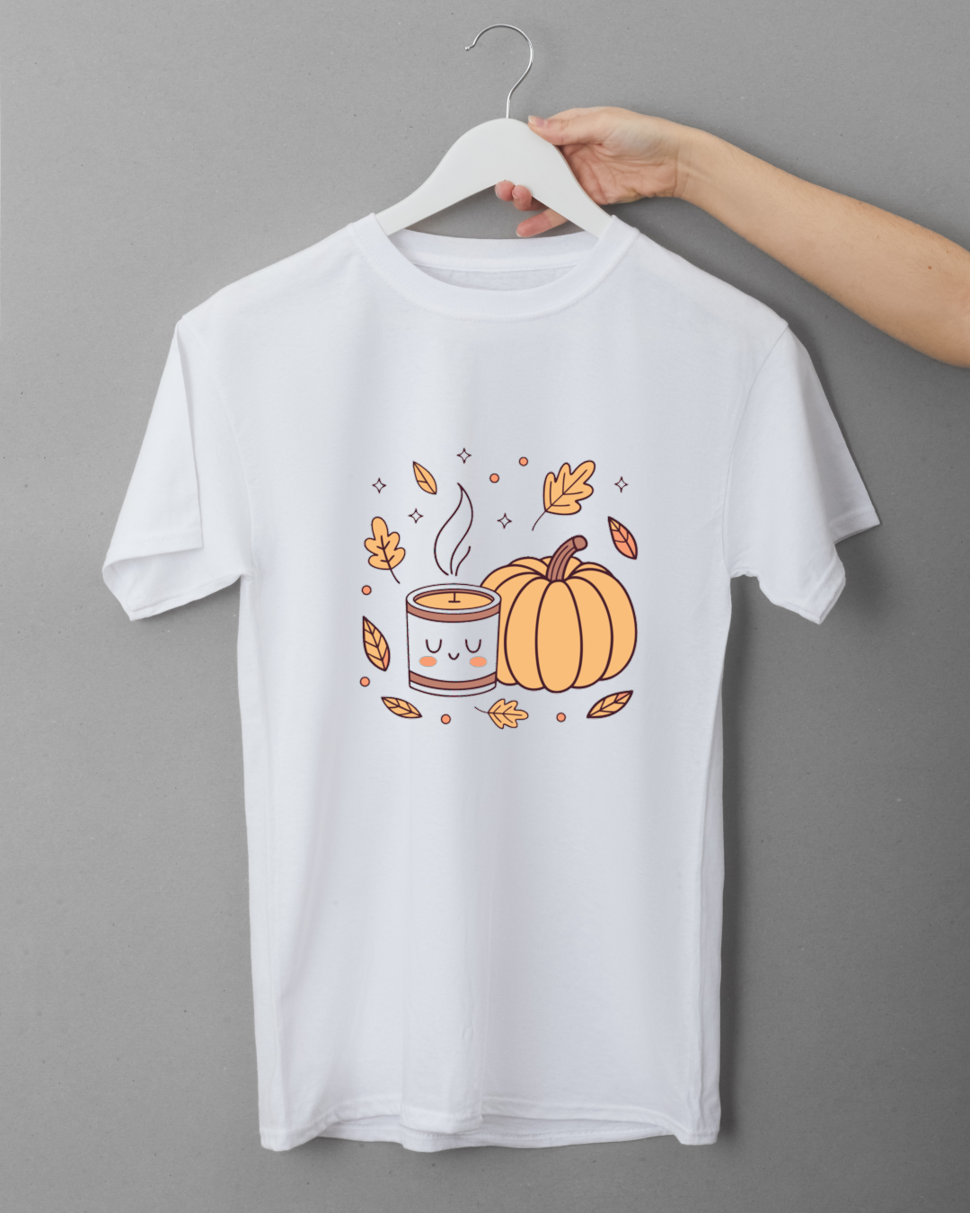 T-shirt automnal avec icône de bougie et citrouille en style doodle