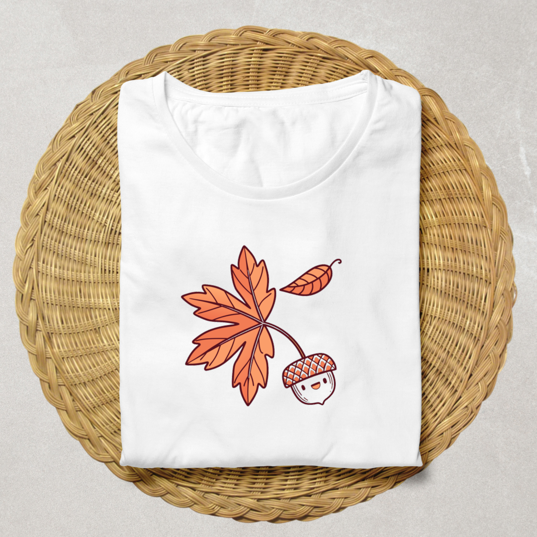 T-shirt décoré d'un gland souriant automnal dans un style pastel évoquant la forêt