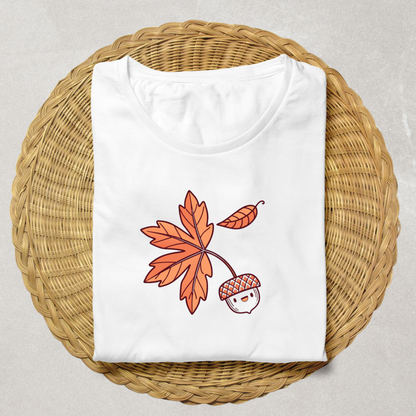 T-shirt décoré d'un gland souriant automnal dans un style pastel évoquant la forêt