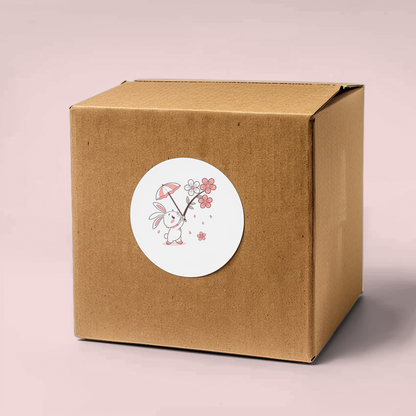 Sticker représentant un lapin joyeux sous un parapluie fleuri dans un style pastel