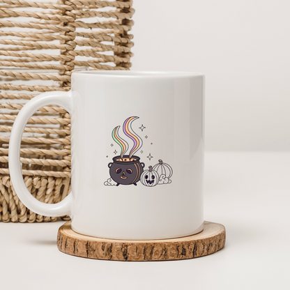 Mug Halloween au design pastel avec un chaudron magique créant une ambiance mystique