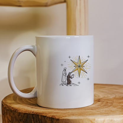 Mug avec icône festive représentant des mages contemplant une étoile de Noël stylisée